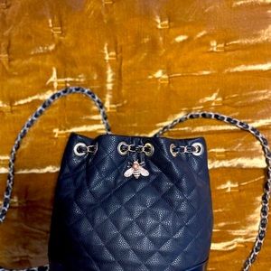 Quilted backpack/bucket bag with metal details